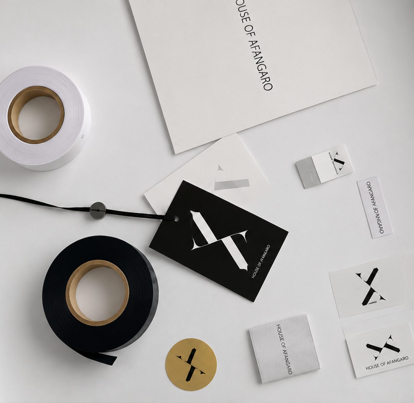 House of Afangaro packaging and label concept — tape, tags and the X monogram